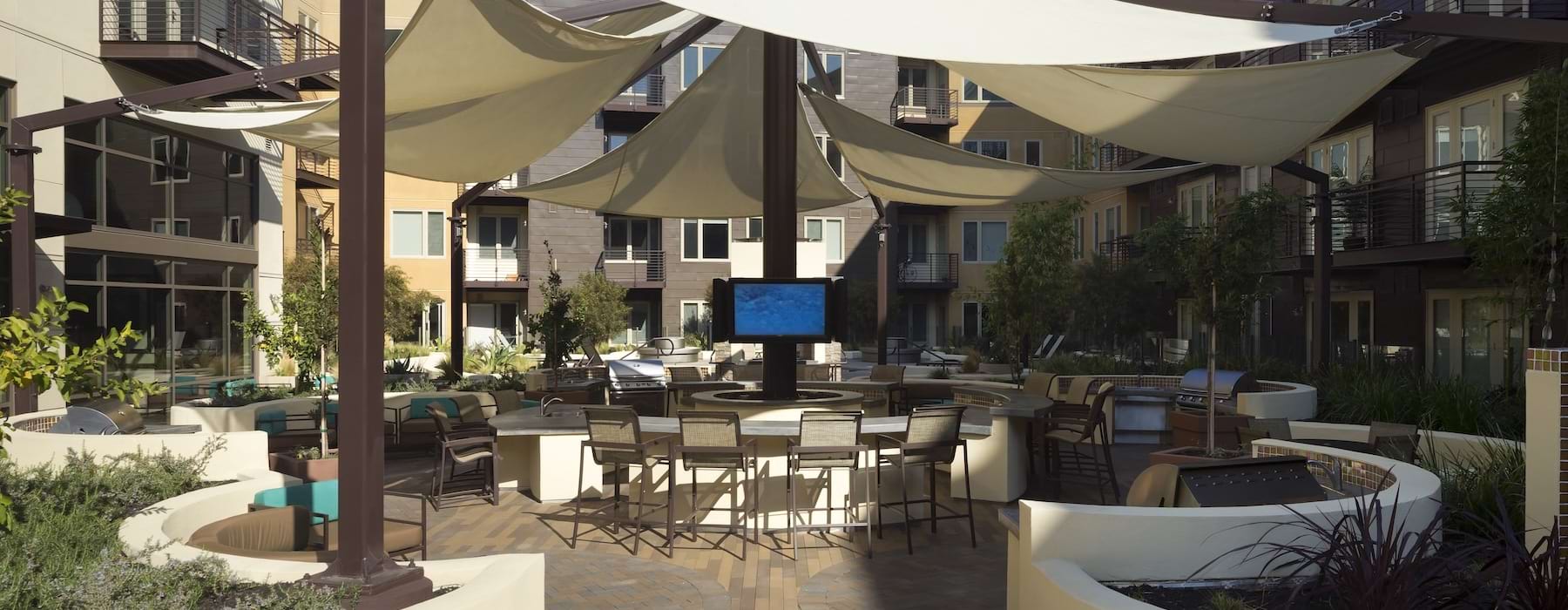 a patio with tables and chairs