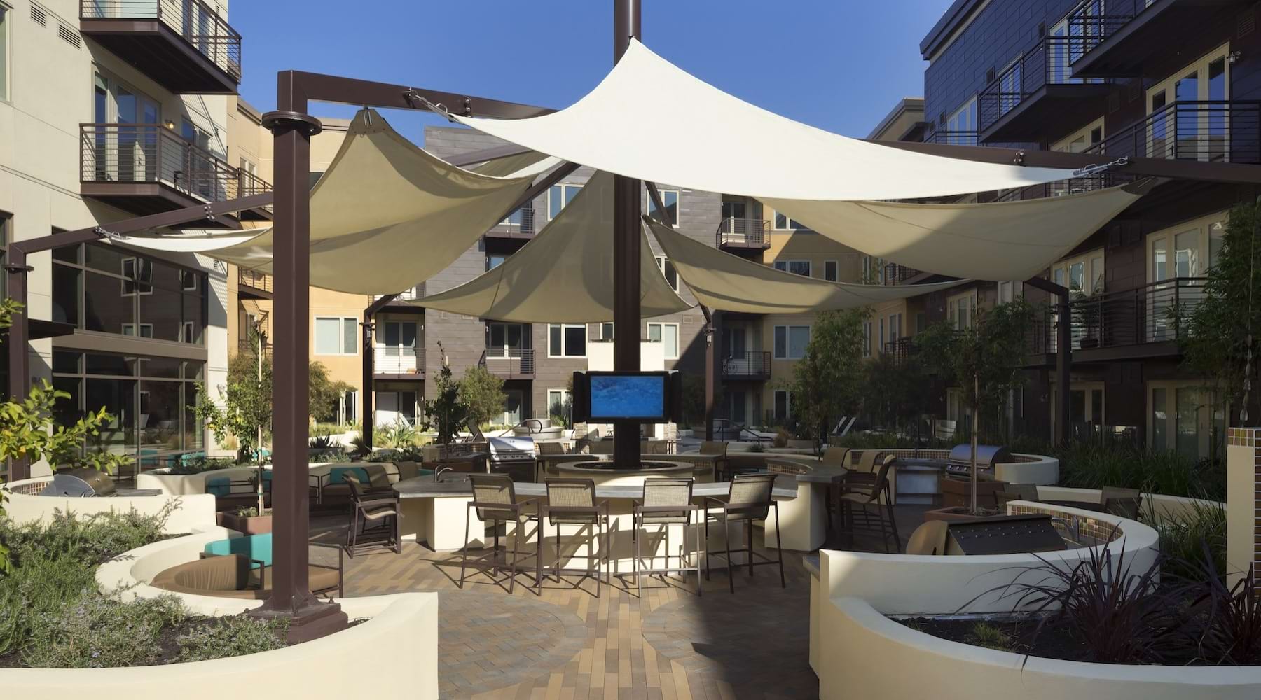 a patio with tables and chairs
