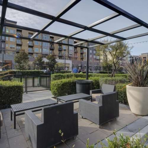 a patio with tables and chairs