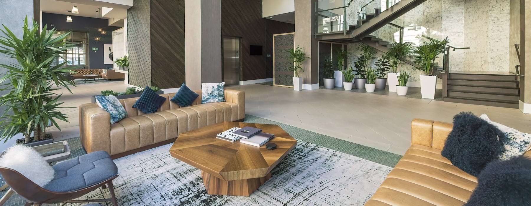 a clubroom with couches, a table and a chair