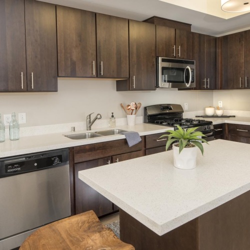 a kitchen with wood cabinets