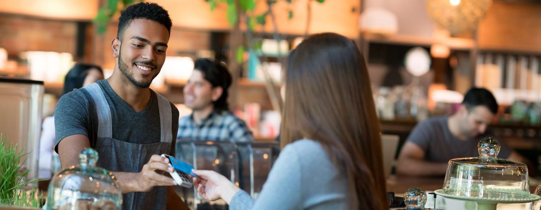 a man and a woman sitting at a bar